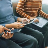 My device of three people as mother, daughter and friends watchi